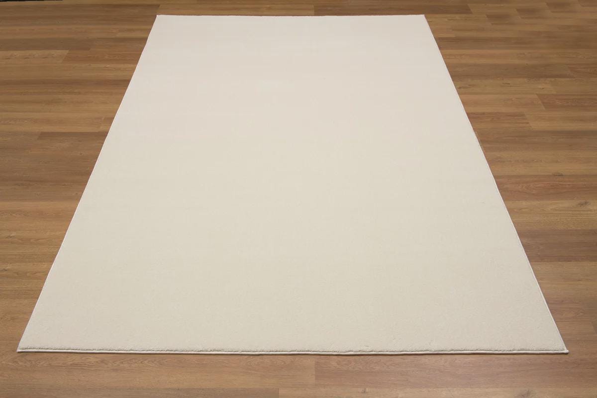 Soft Cream Minimalist Rug: Modern Light Carpet for Contemporary Spaces